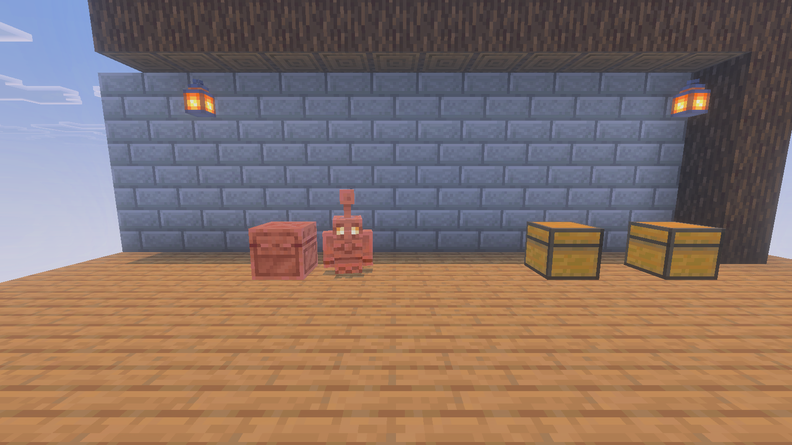 A copper golem beside copper and ordinary chests in our small Bedrock workshop scene.