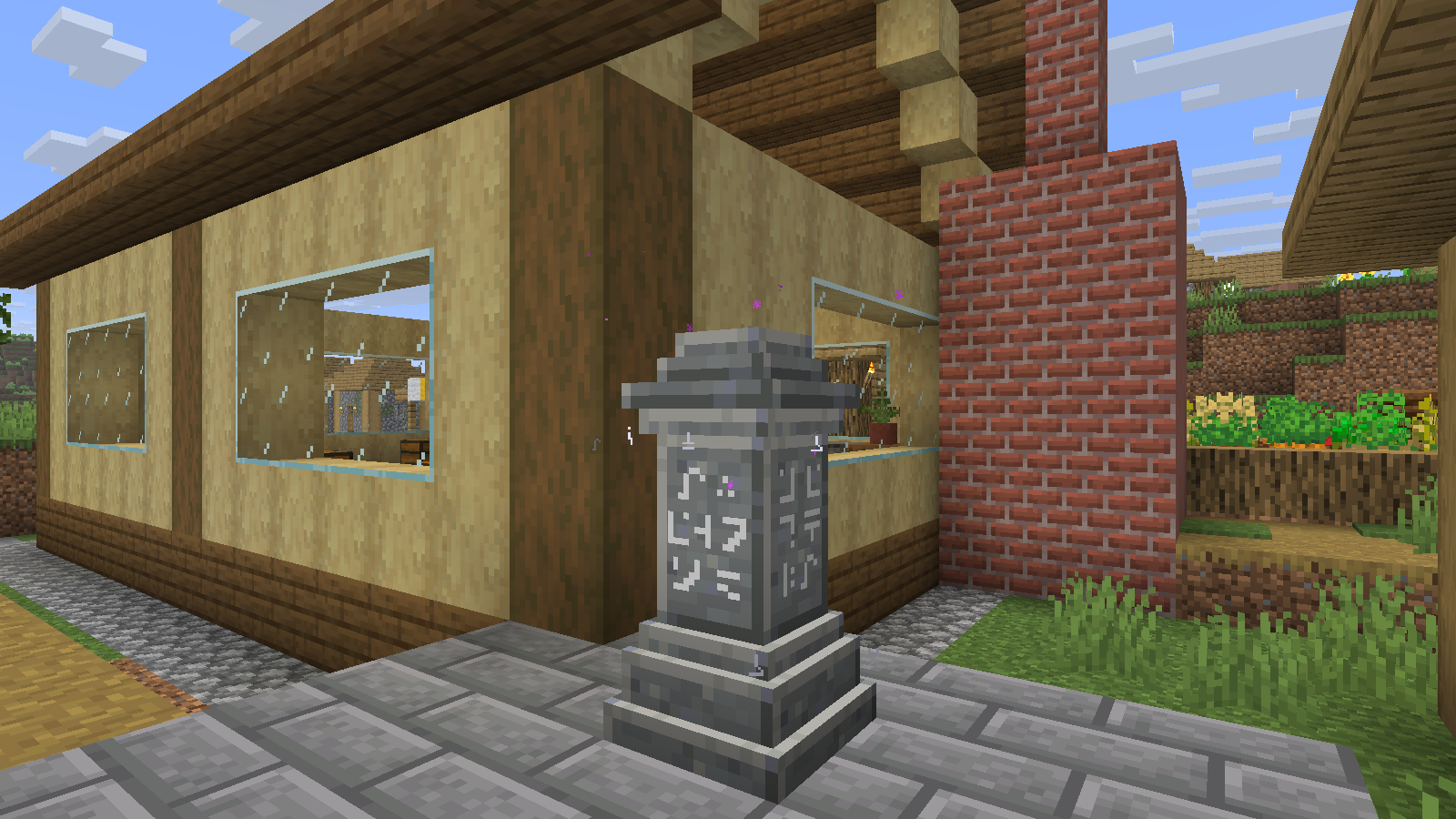 The Village Workshop waystone sits beside the work area.