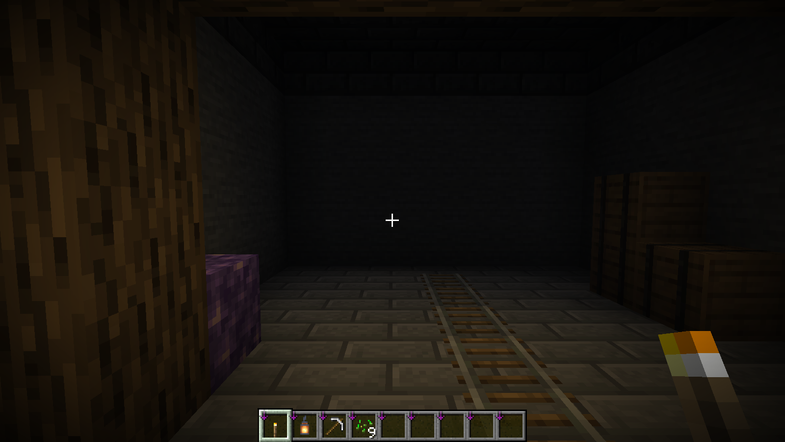 The same corridor and camera position brighten with a torch selected.