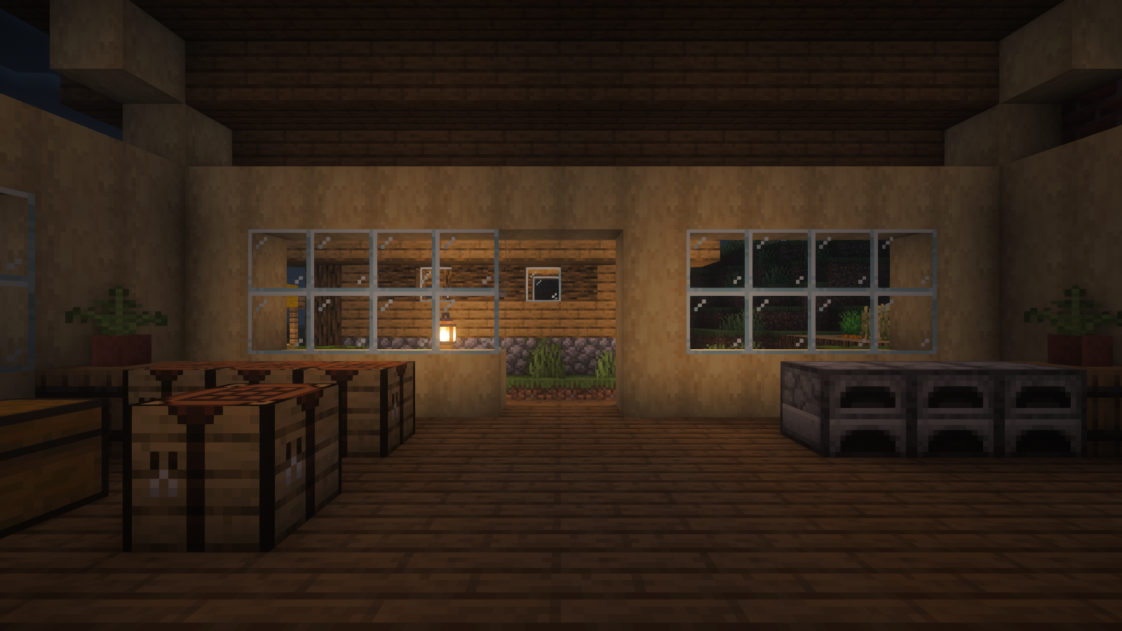 A warm lantern outside the workshop window contrasts with the darker room at night.