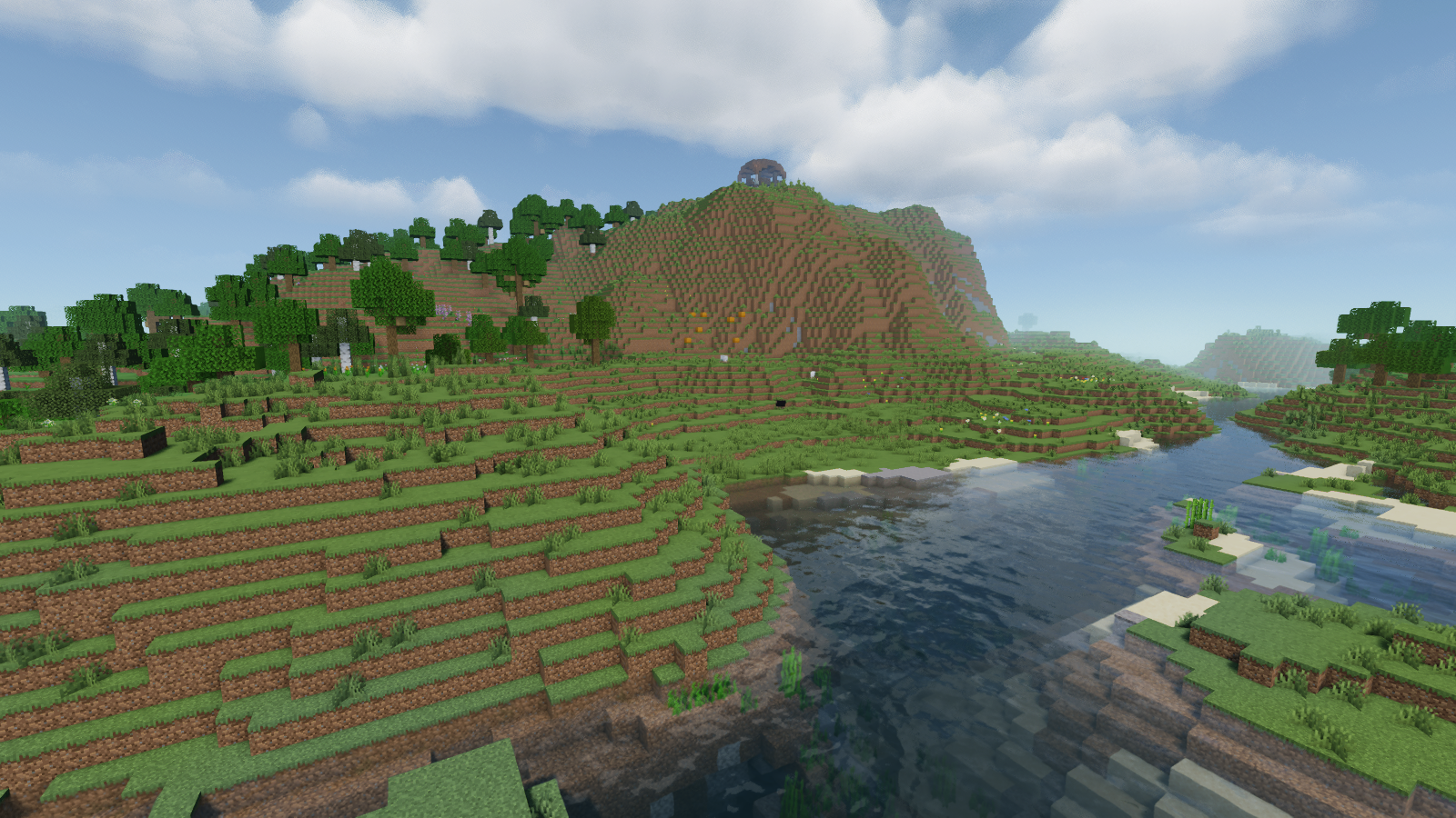 MakeUp adds visible surface reflections to the river beside the grassy bank.