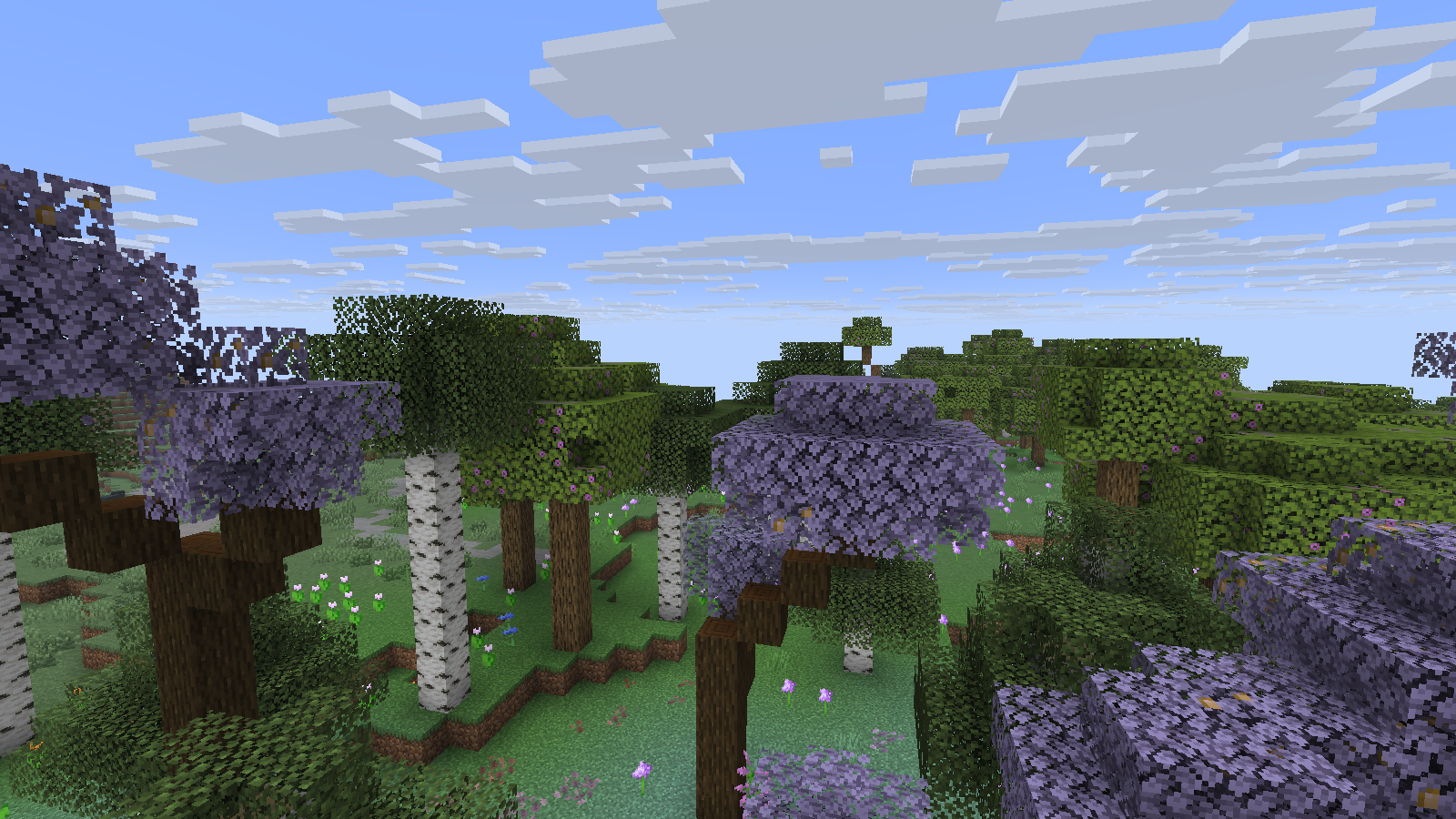 Purple and green tree canopies above flowers in the Blooming Valley area.