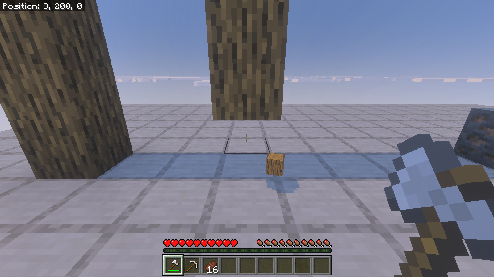 Artificial oak-log column after ordinary axe mining, with its bottom block missing and one log item on the platform.
