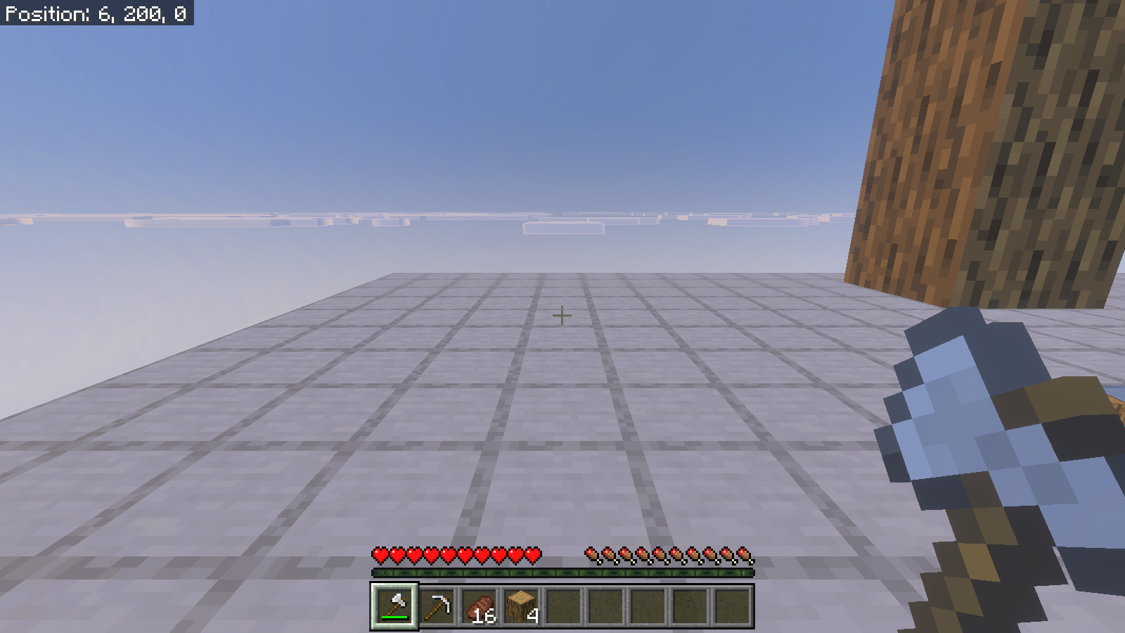 Empty site of the matching four-log column after sneak-mining; the hotbar shows four oak logs.