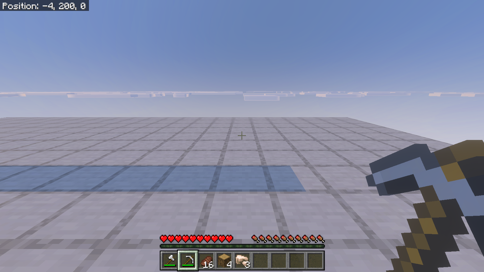 The empty ore-row site after sneak-mining, with three raw iron visible in the hotbar.