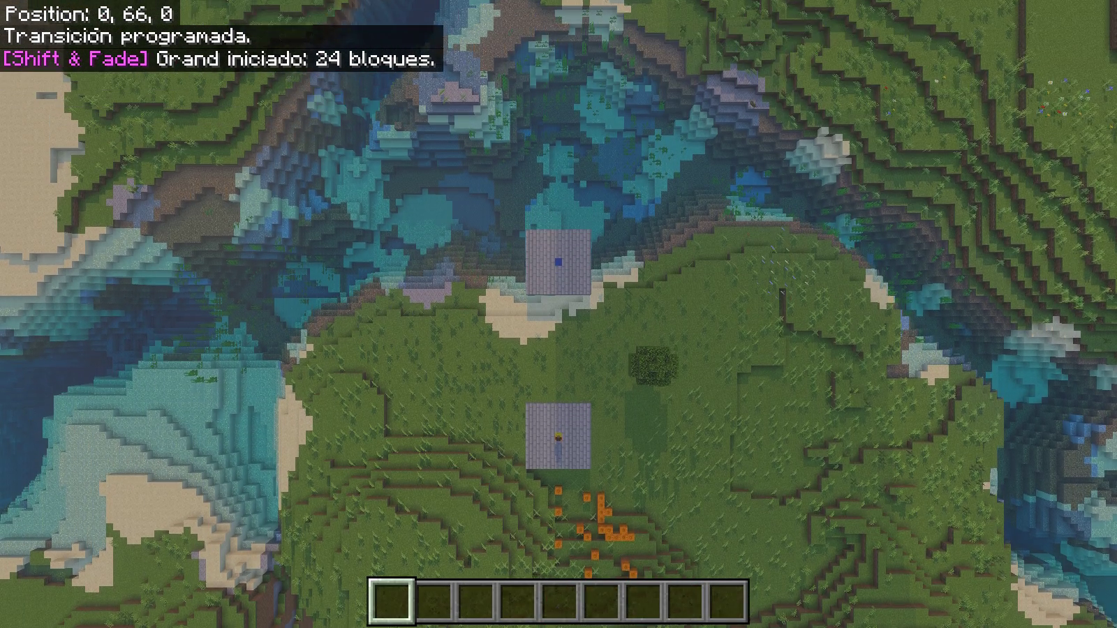 Overhead native Grand transition frame showing two stone-brick pads beside a river.