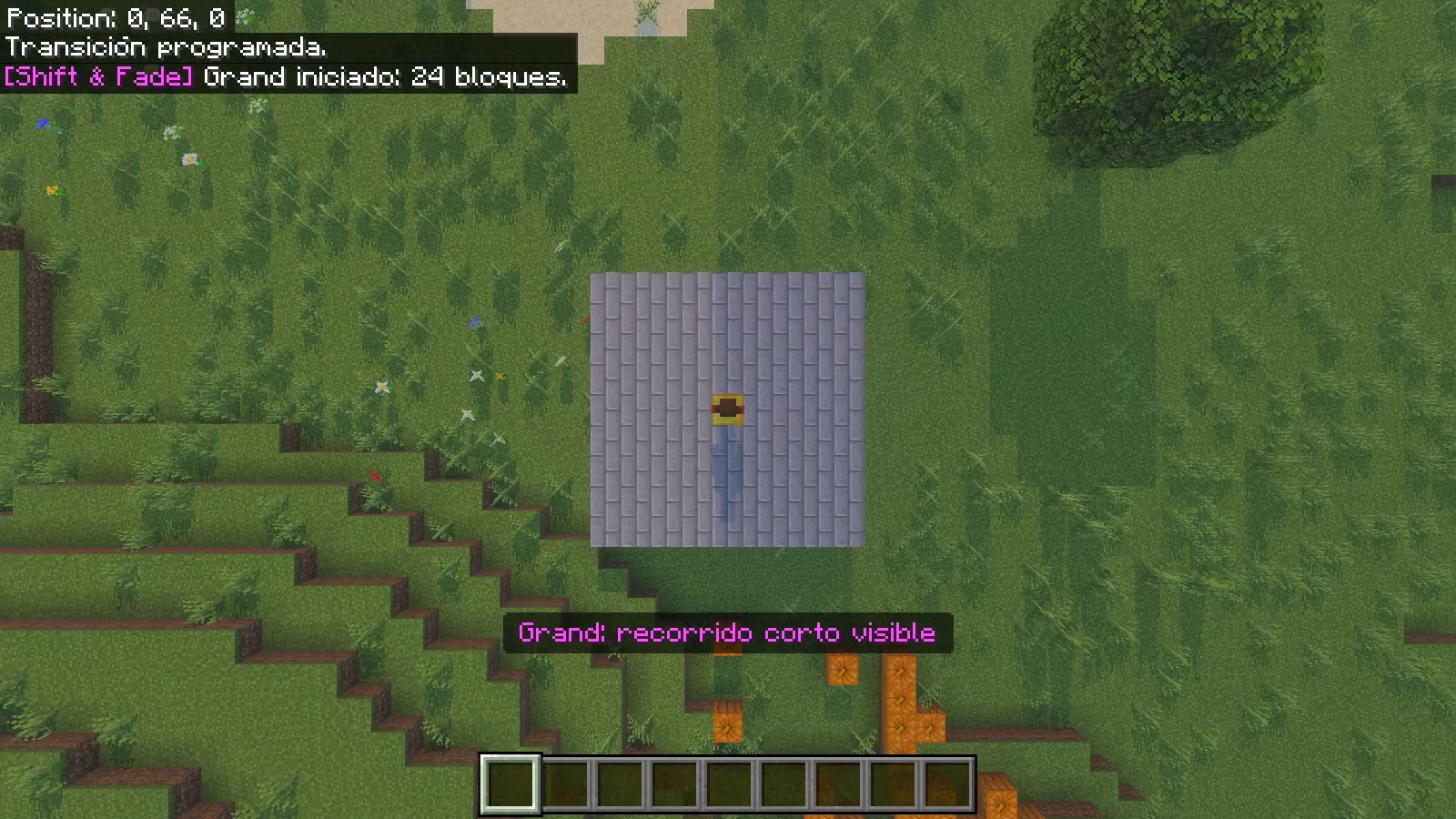 The player stands on a gold center block as the actual Grand camera looks down from above.