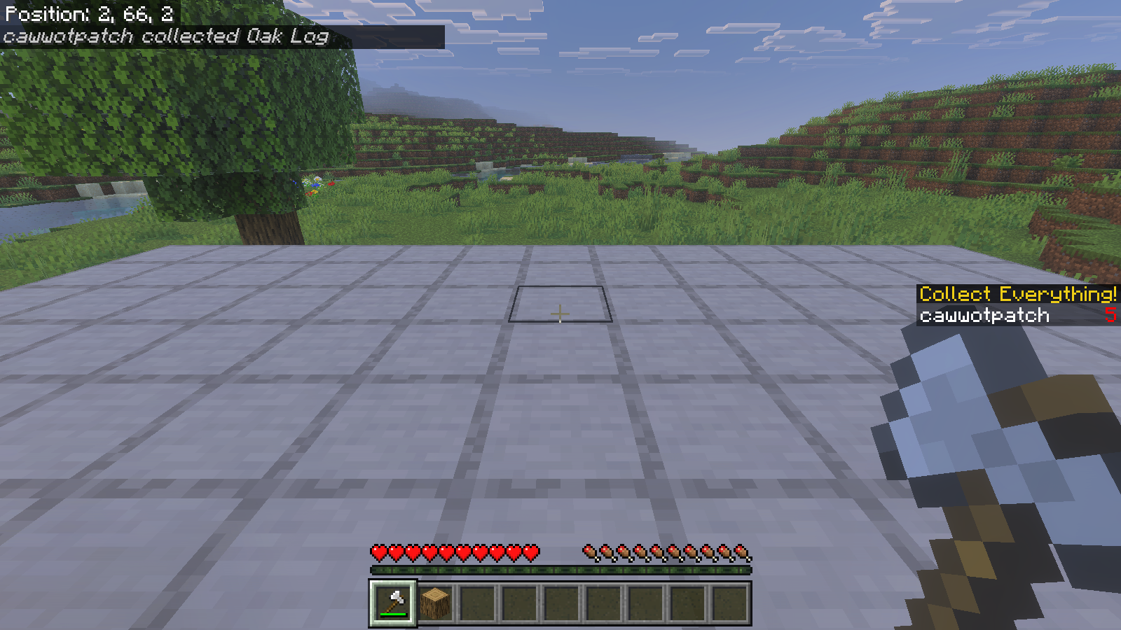 Iron axe held beside an empty log position, with an oak log in the hotbar and collected Oak Log notification.