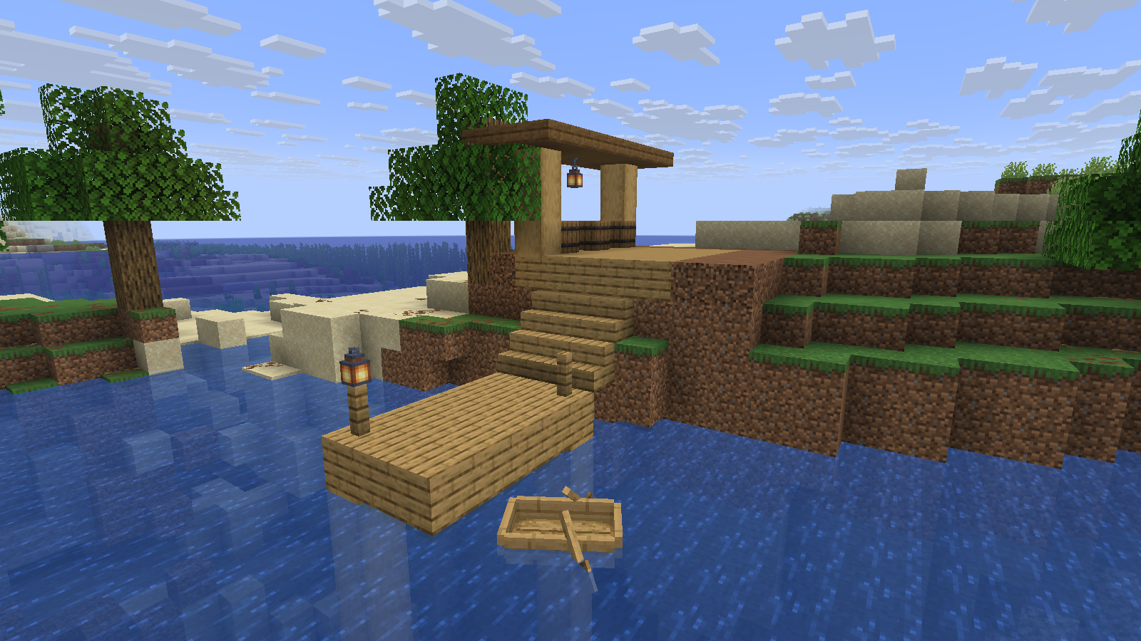 Small wooden pier and boat below a riverside storage shelter.