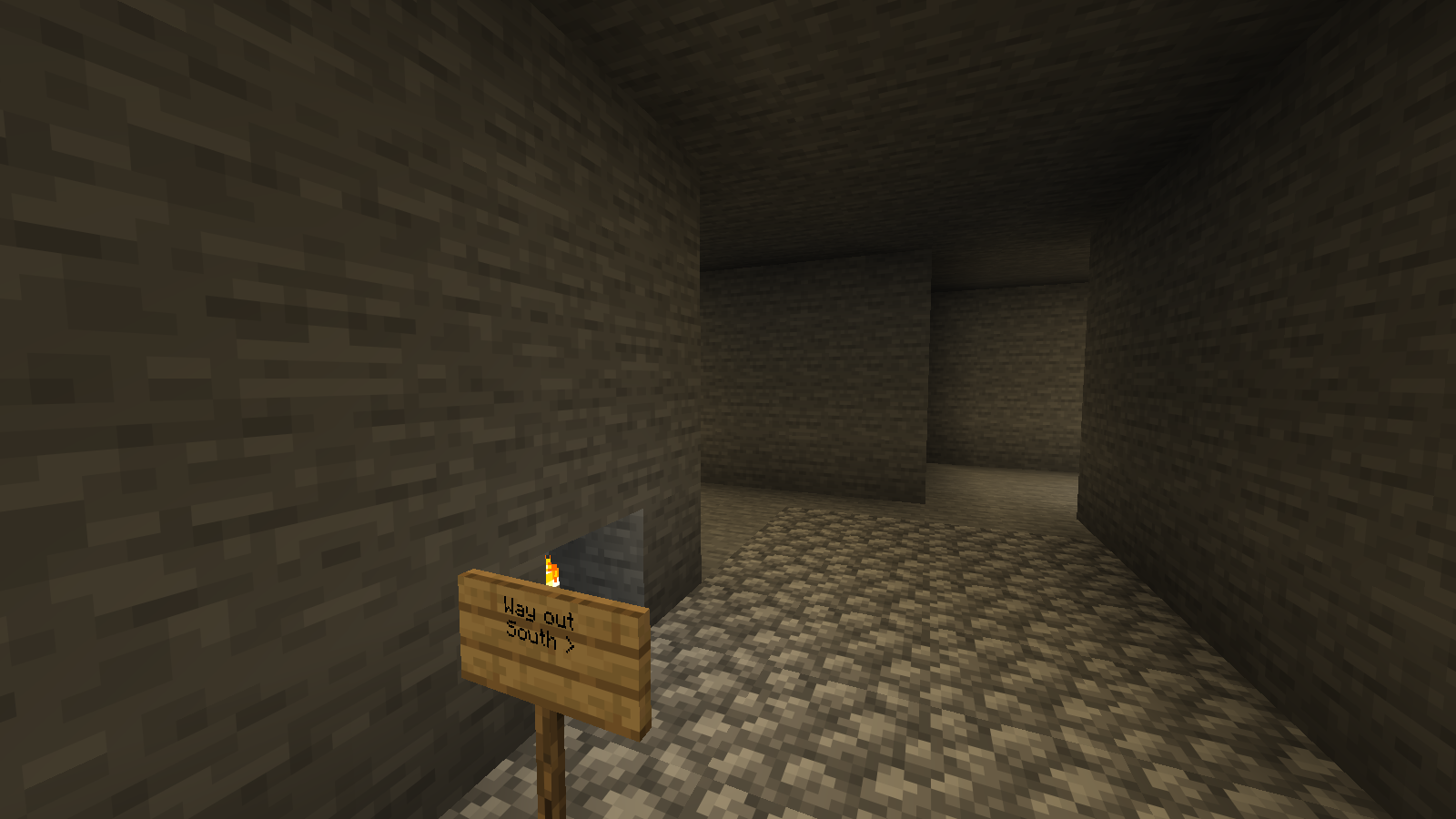 A torch and exit sign make the return direction explicit at a prepared cave fork. Java 26.2 demonstration build.
