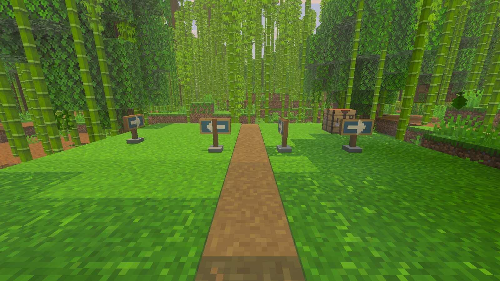 Four turquoise arrow markers on wooden posts beside a path through bamboo.