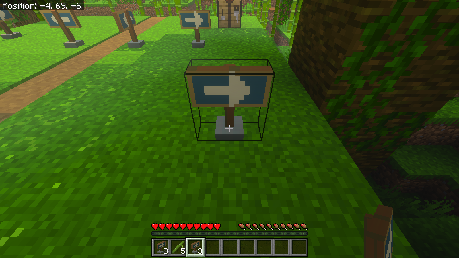 Close view of a newly placed turquoise arrow marker and the Survival hotbar showing three remaining markers.