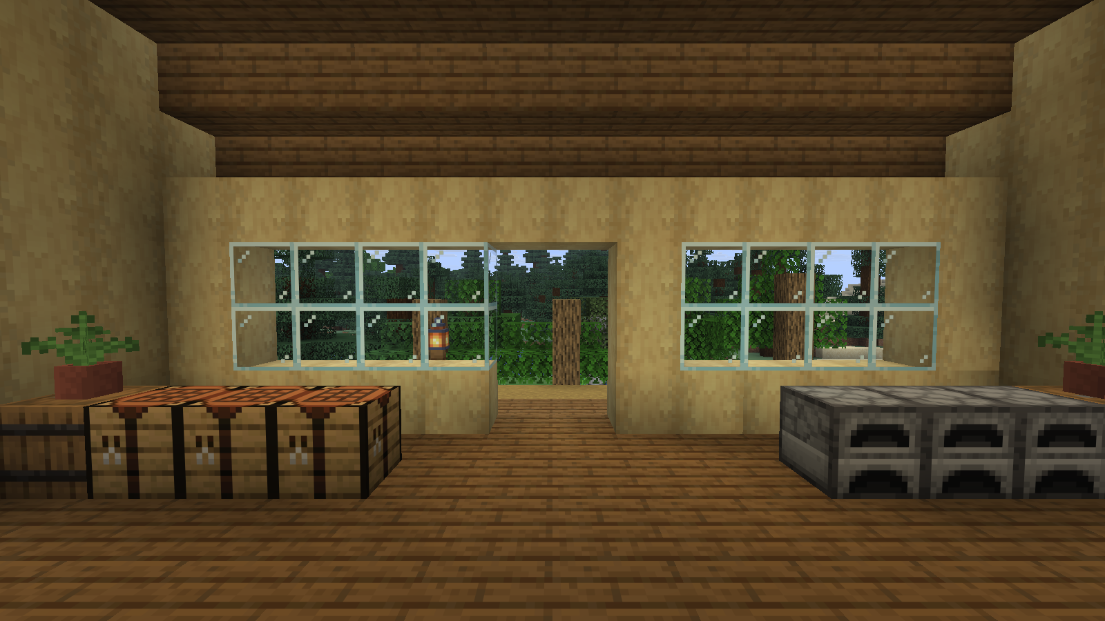 Crafting tables and furnaces face a bright glazed entrance, with open floor space between them.