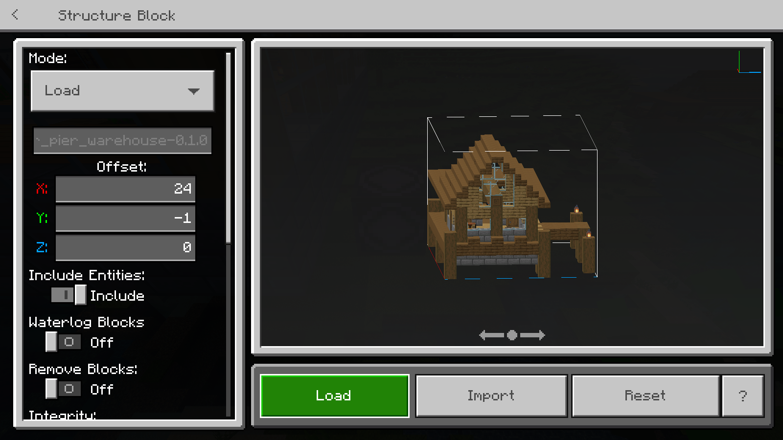 Bedrock structure block in Load mode showing the imported warehouse file and building preview.