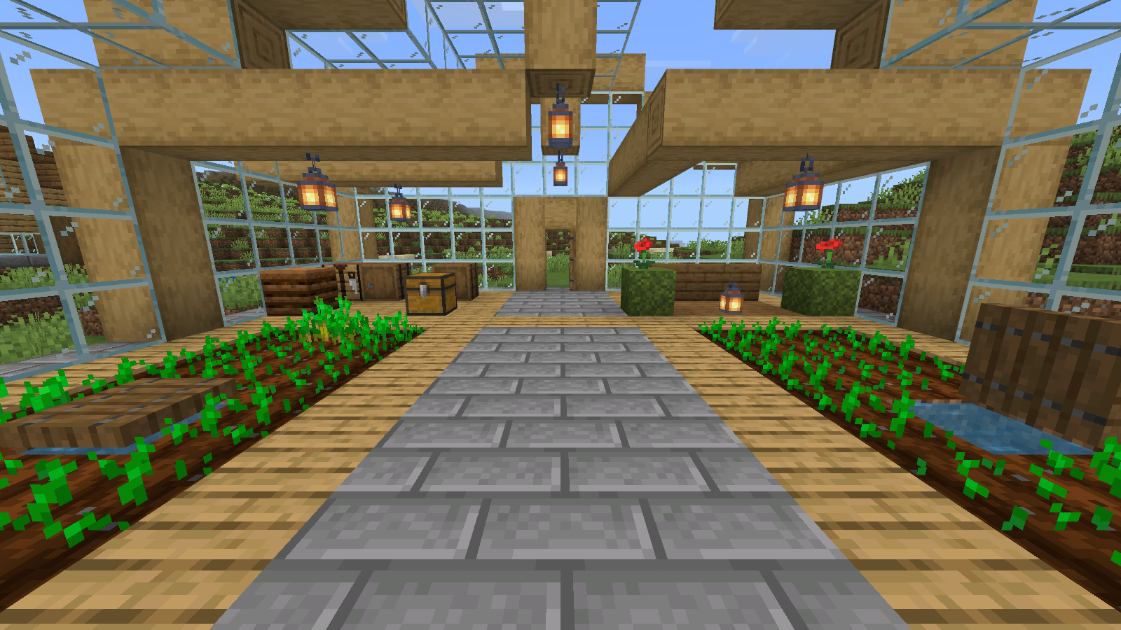 Default-texture greenhouse interior with a stone-brick aisle between planted beds.