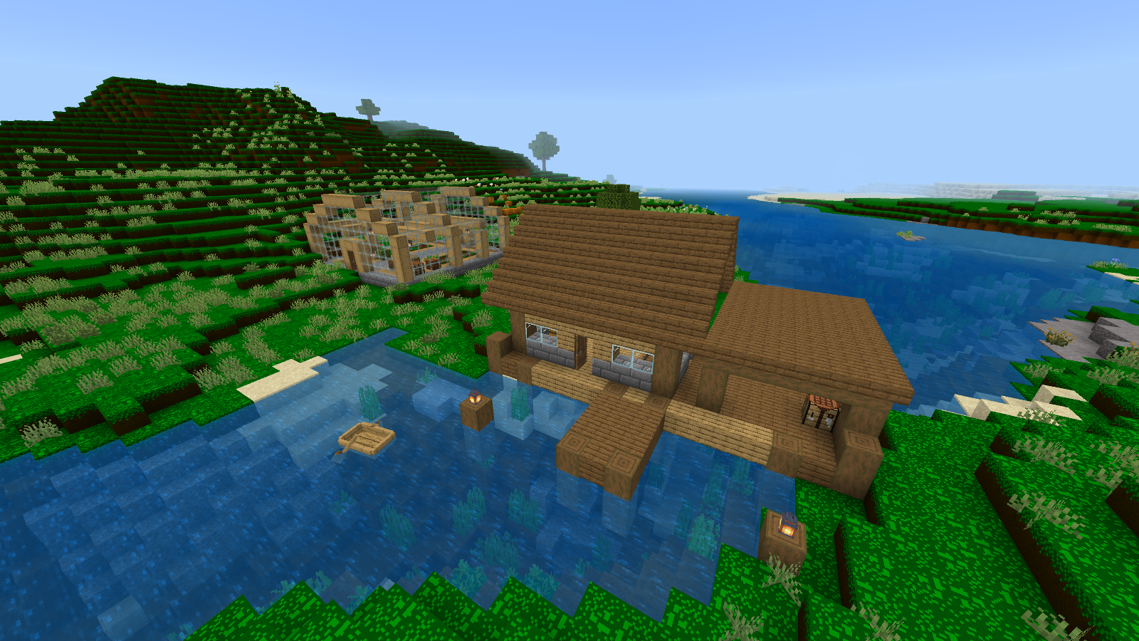 River warehouse and greenhouse surrounded by bright green, strongly patterned CheapDesign grass.