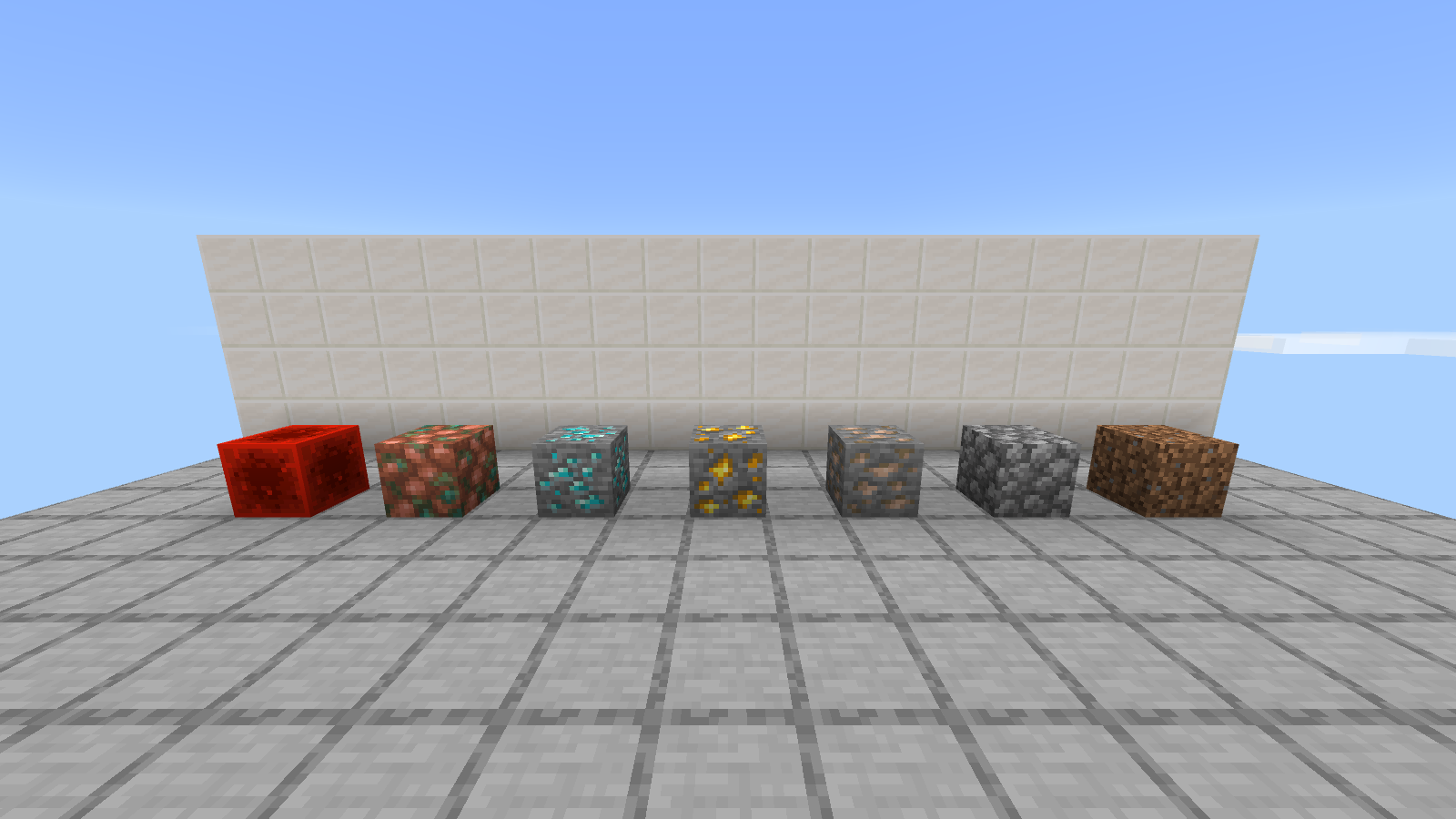Seven default-texture material samples on a neutral gray floor in front of a white wall.