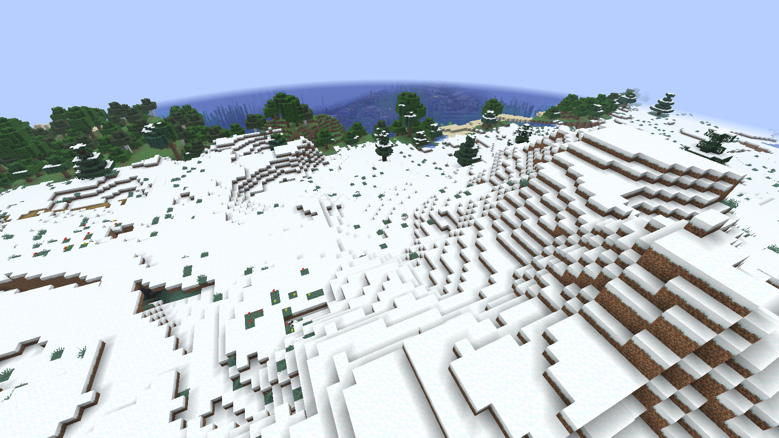 Snow-covered starting slopes with scattered spruce trees and coastal water in the background.