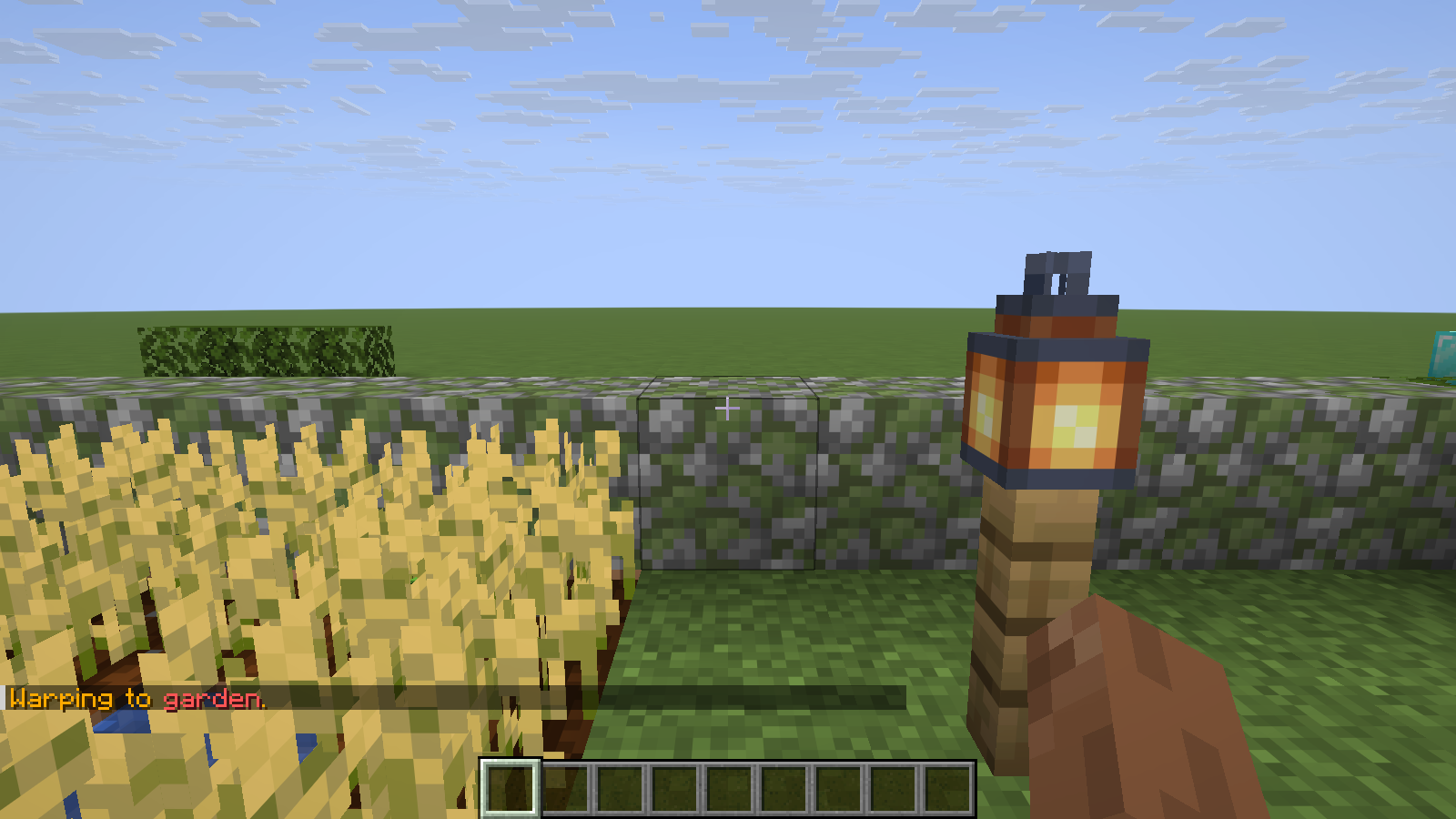 The named garden warp arrives beside the crops and lantern.