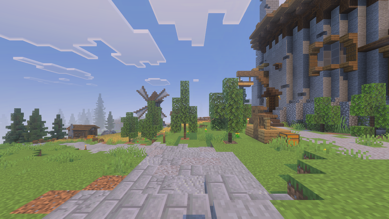 Street-level view of Gendry’s Tavern, landscaped paths, fields and a windmill in the distance.