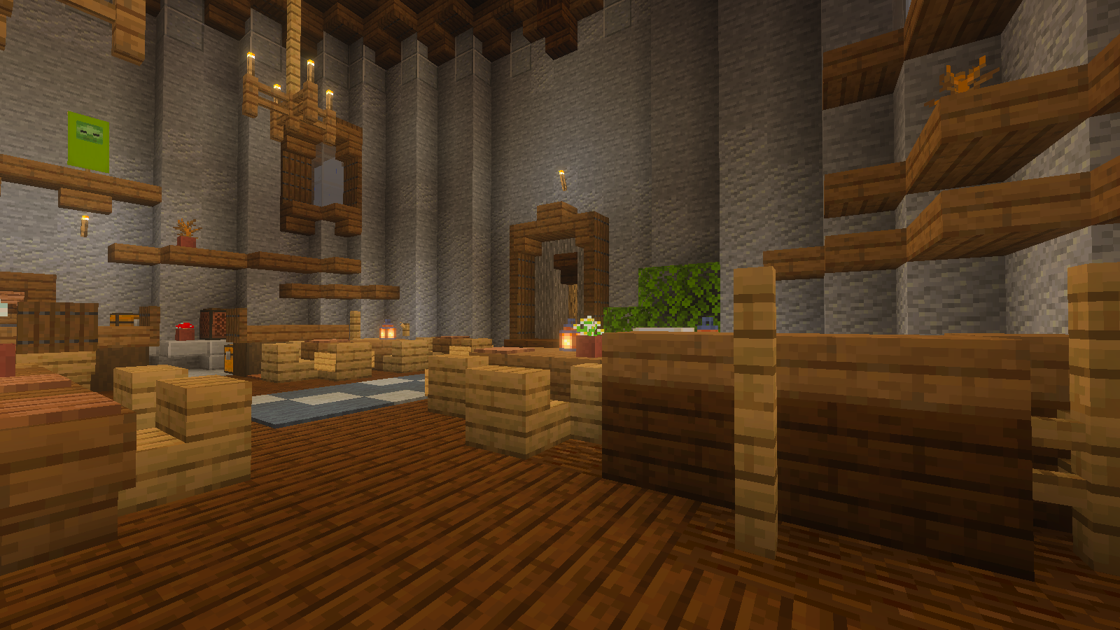 Wooden benches and tables beside a potted flower, lantern and doorway in the tavern hall.