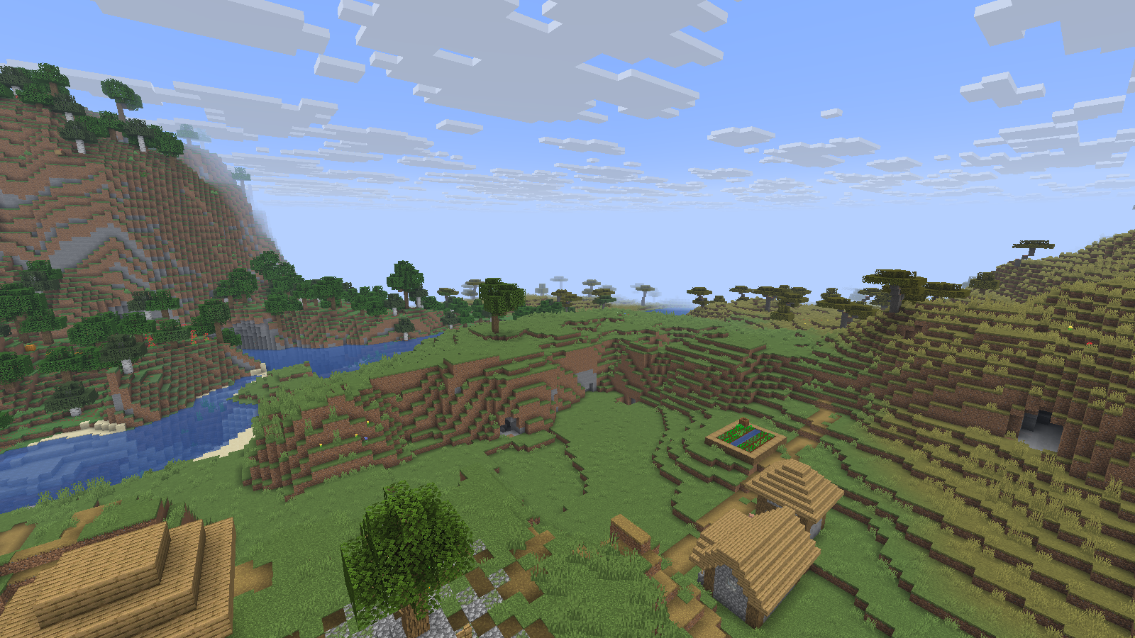 A village, grassy slopes and river viewed with Fabulously Optimized 14.1.0 and no shader.