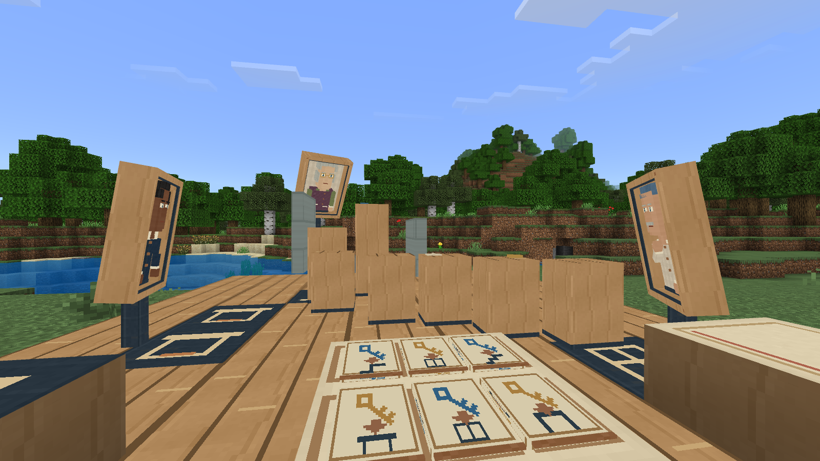 Three living portraits surround the Stillframe Gallery beside a Minecraft river.