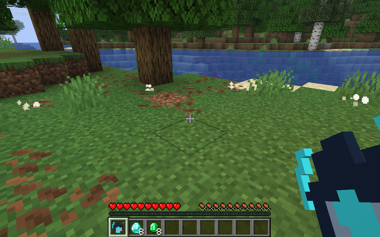 The same riverbank after using Orbit Gauntlet, with eight diamonds and eight emeralds collected in the hotbar
